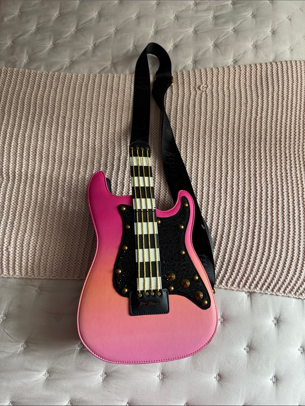 Betsey Johnson’s Pink Gradient Guitar Crossbody Bag